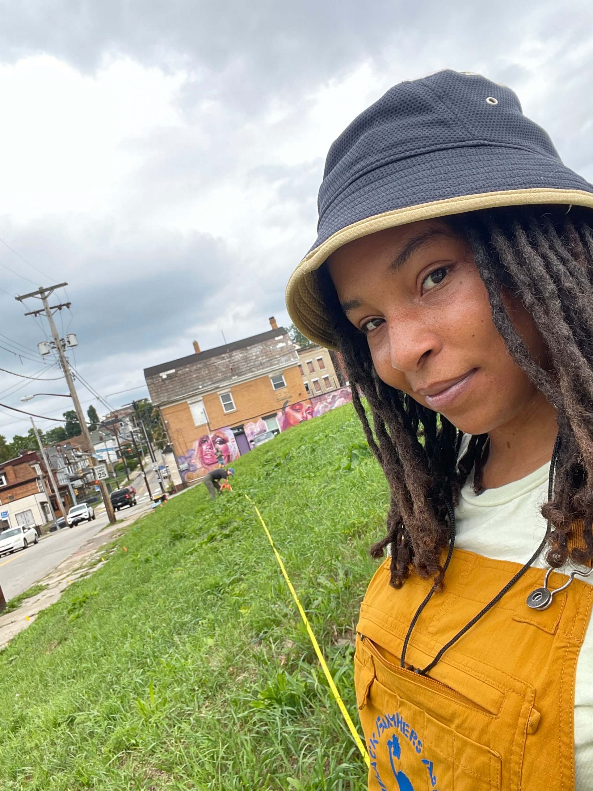 Photo of Raynise Kelly at the Soil Sister's Greenhouse lot