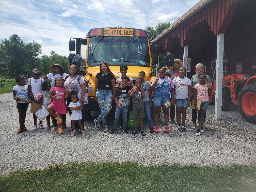 School children visit the Soil Sisters Greenhouse