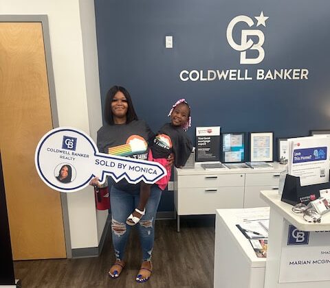 Vanessa Jordan and her daughter in the realtor's office