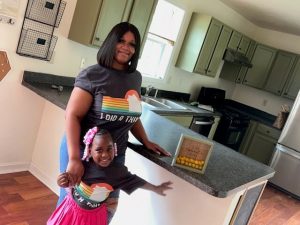 Vanessa Jordan and her daughter in their new home