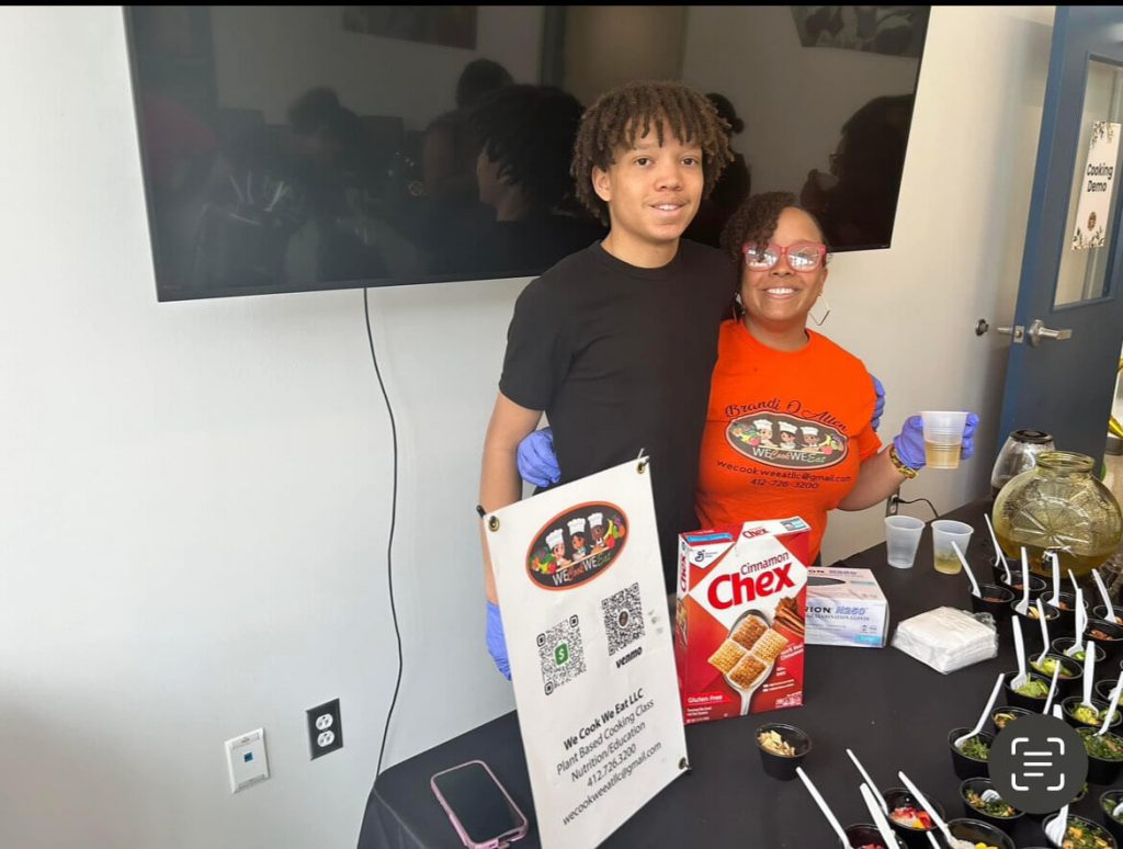 Brandi Allen teaching students how to cook