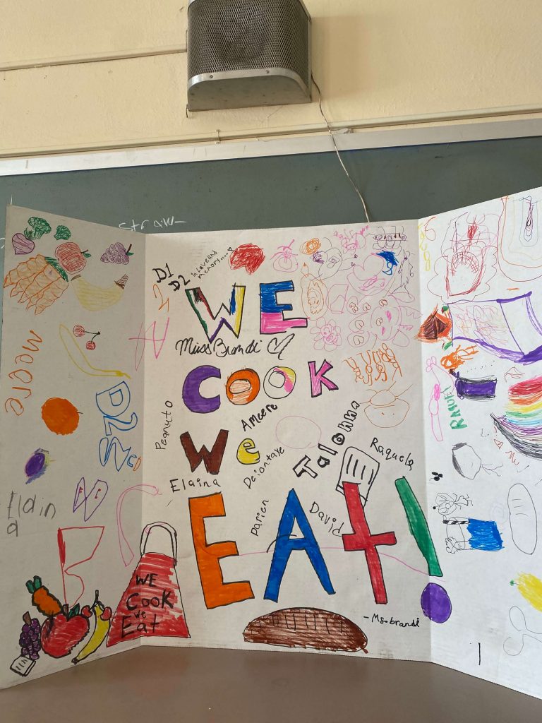 Sign that says "We Cook We Eat"