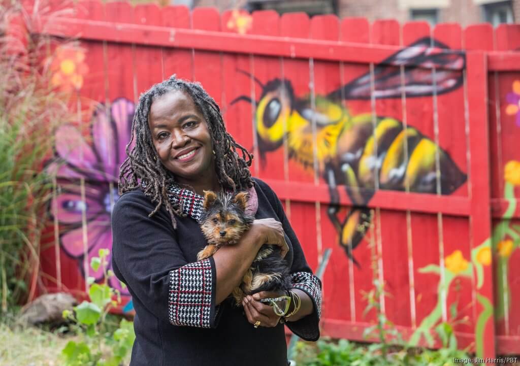 Lisa Freeman at the Freeman Family Farm and Greenhouse, pictured with her dog, Wilma